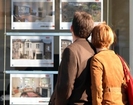 Couple looking at house ads