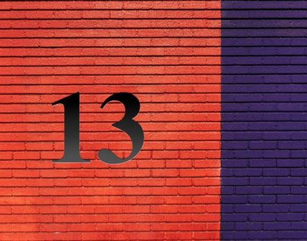 number 13 on a brick-wall
