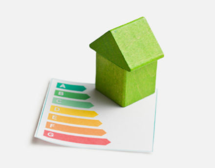 Green wooden houses and energy graph