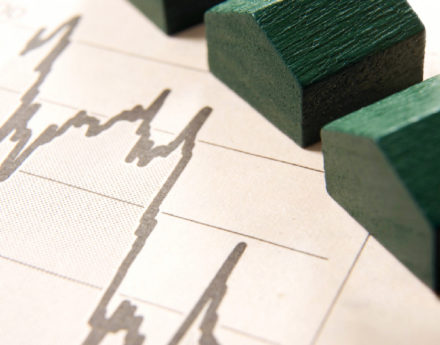 wooden toy houses and a graph