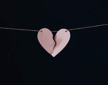 Broken paper heart on a string