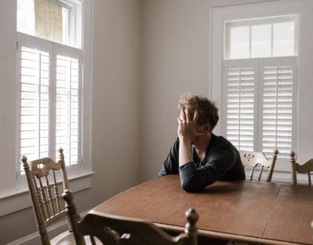 Man holding his head