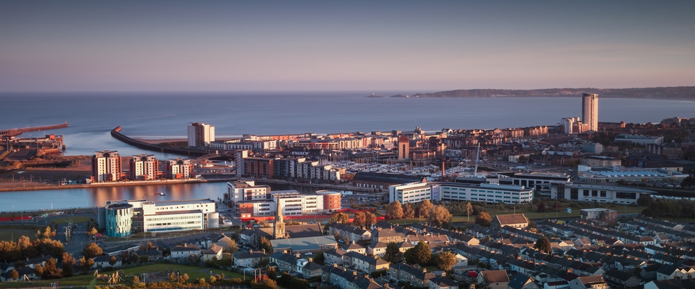 Aerial view of houses along the seafront in Swansea | sell house fast in Swansea